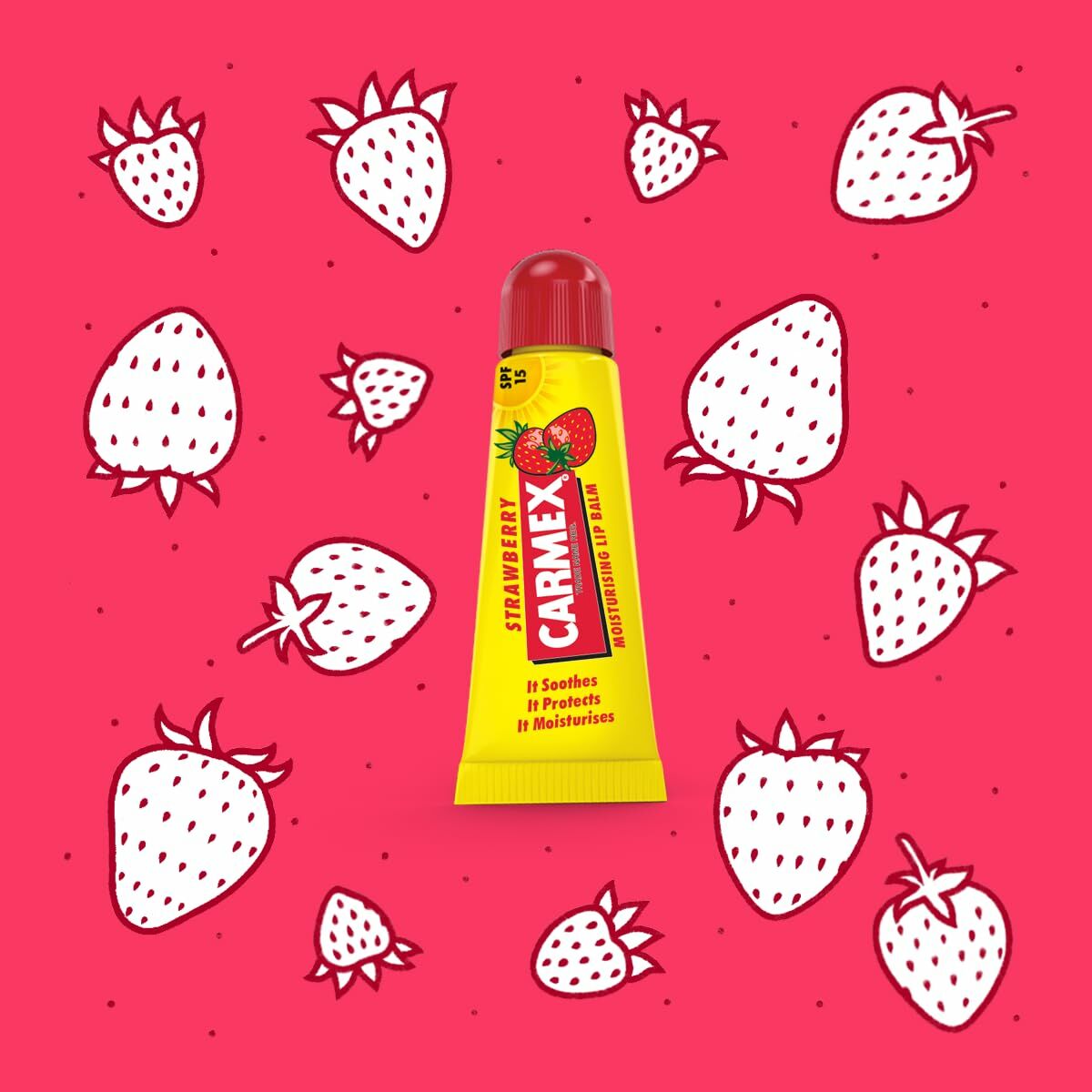 Carmex Strawberry Lip Balm on a pink background with illustrated strawberries, hydrating and protecting lips.