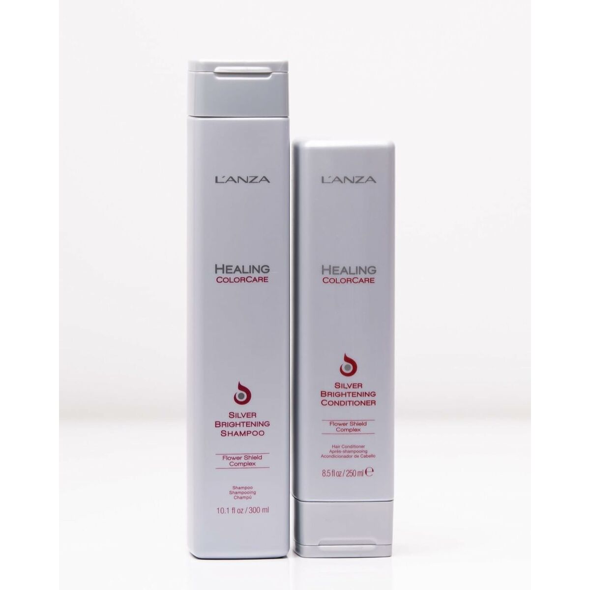 L'ANZA Healing Colorcare Silver Brightening Shampoo and Conditioner duo on a white background.