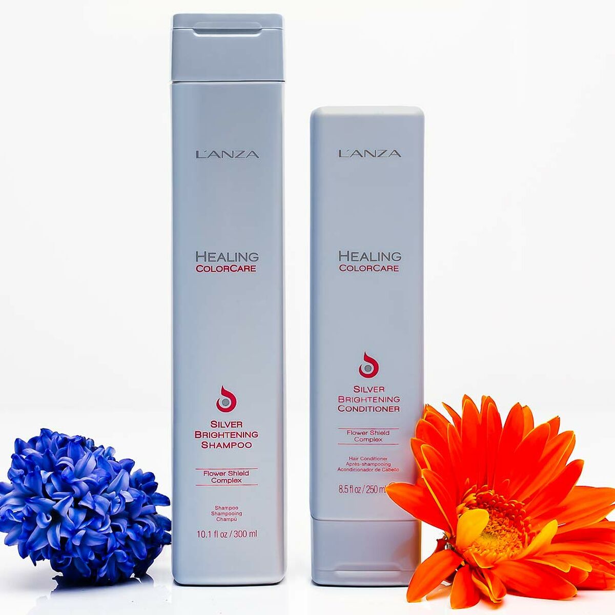 L'ANZA Healing Colorcare Silver Brightening Shampoo and Conditioner with flowers, 330ml and 250ml bottles