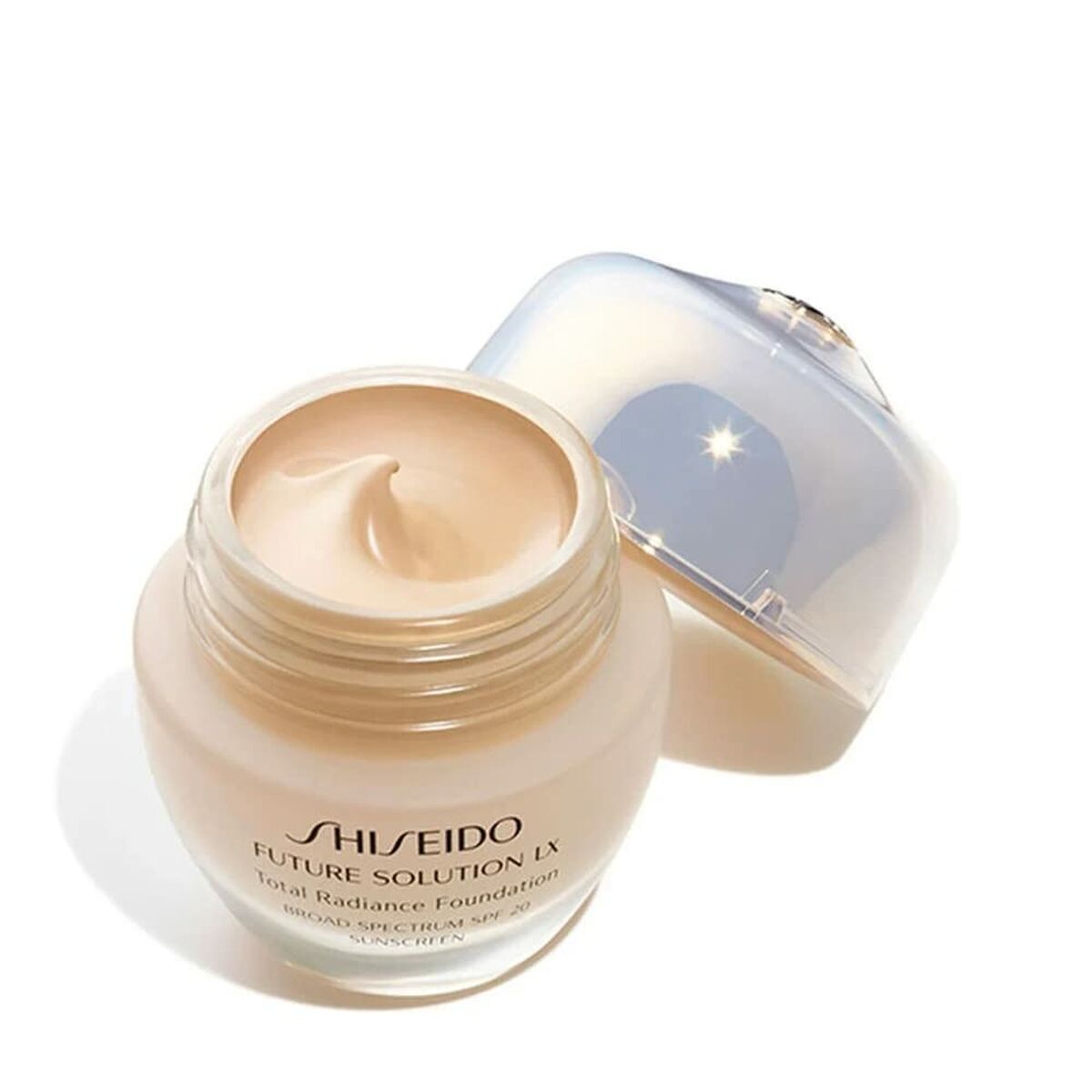 Base de Maquillage Crémeuse Shiseido Future Solution LX, crème foncée dans un pot ouvert, soin pour un éclat radieux.