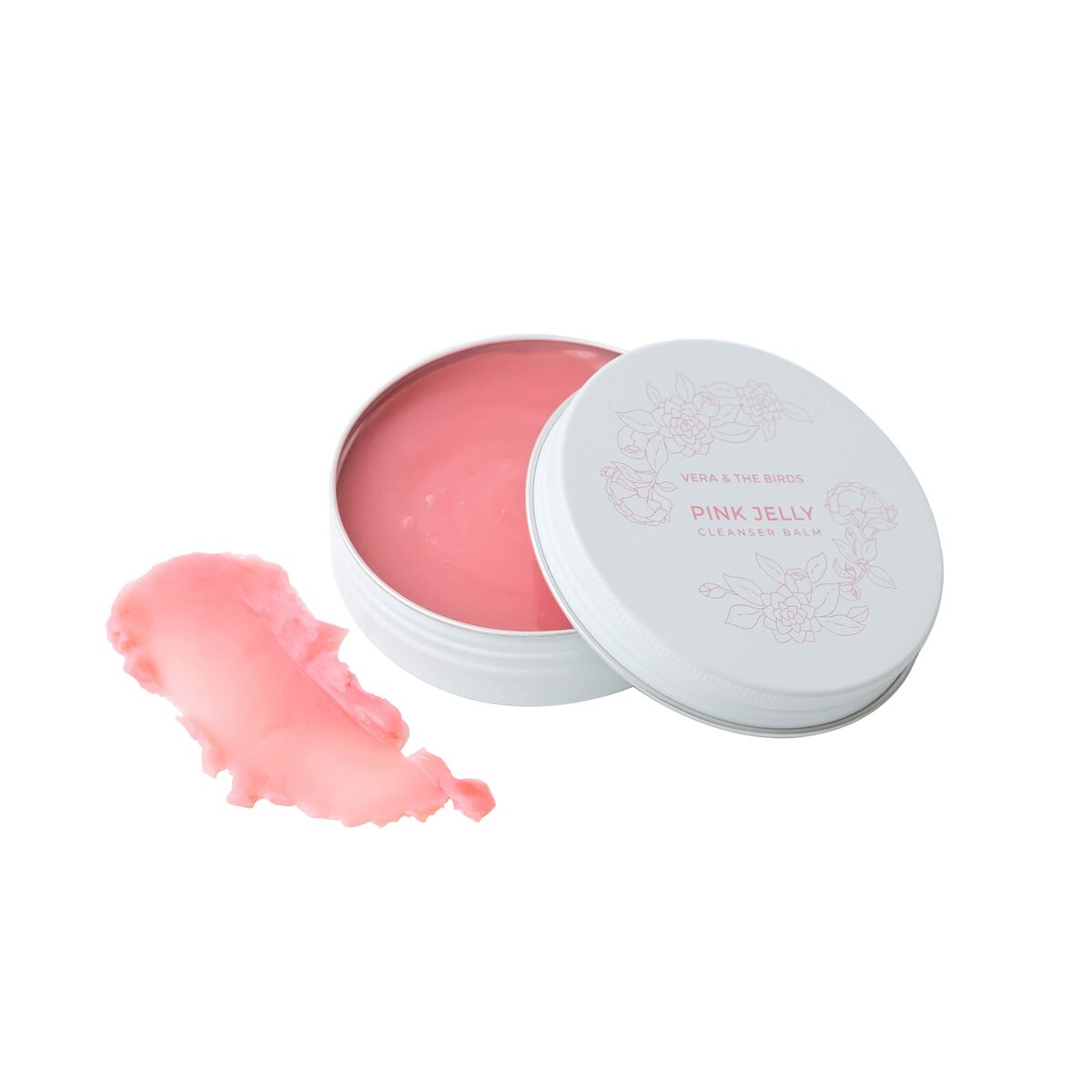 Pink Jelly skincare balm in a white tin with a pink interior and a smear beside it.