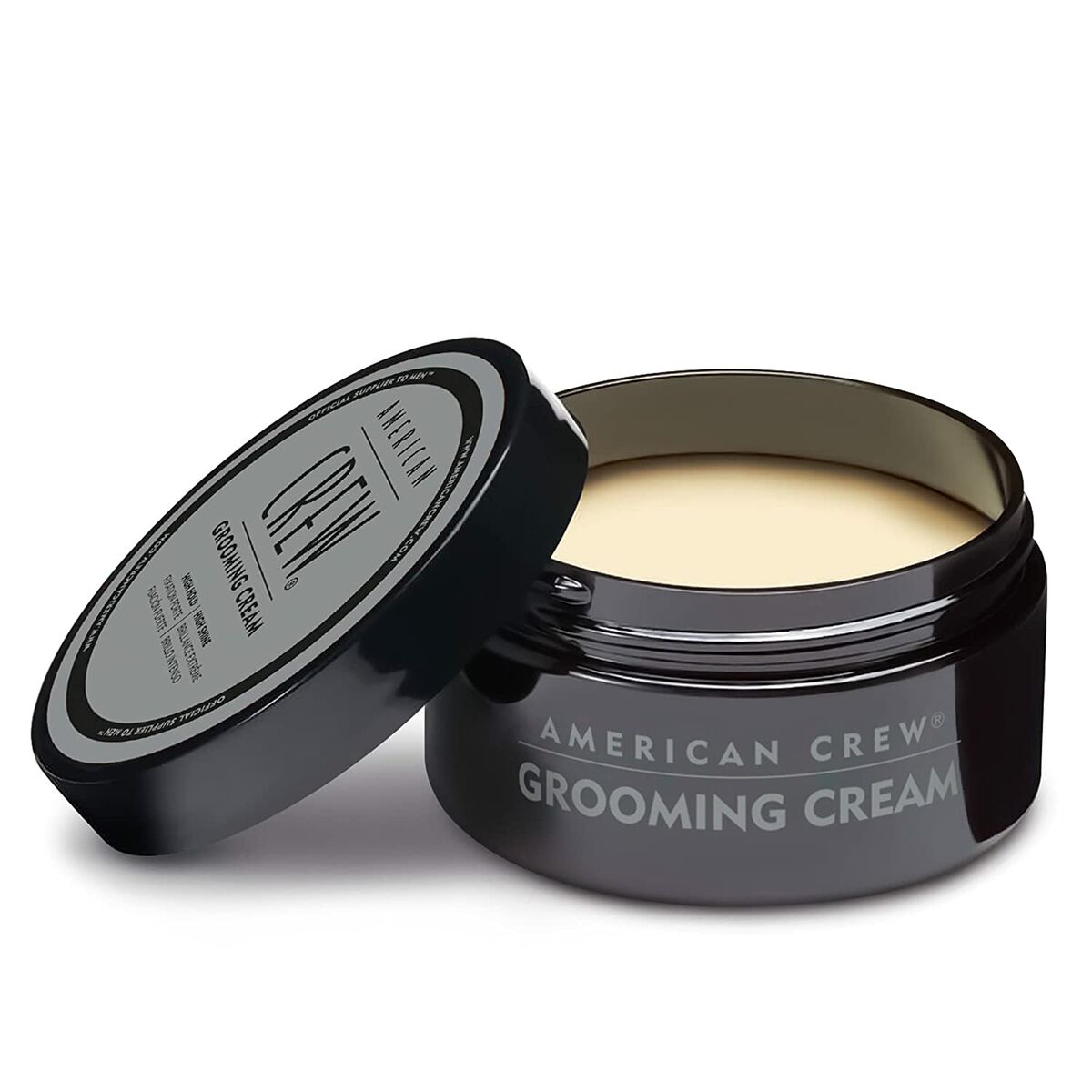 American Crew Crème Fixative Très Forte Grooming Cream 85g in a black jar for strong hold and hydration.