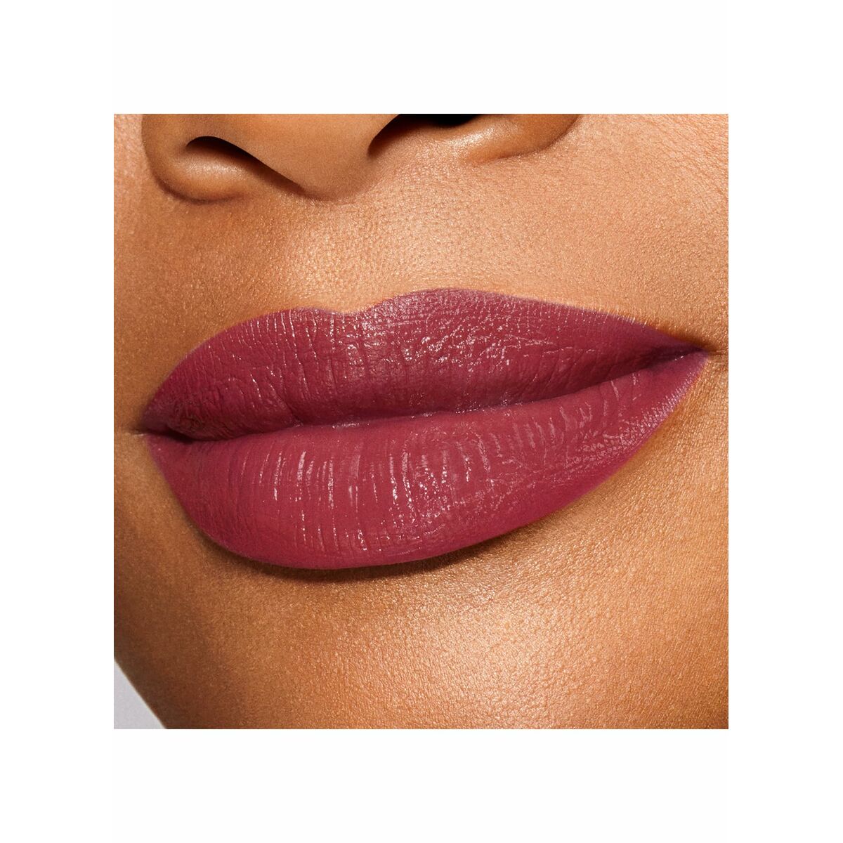 Lips wearing Estee Lauder PURE COLOR Desire Me-01 Nº 321-Shhh lipstick in a rich mauve shade.