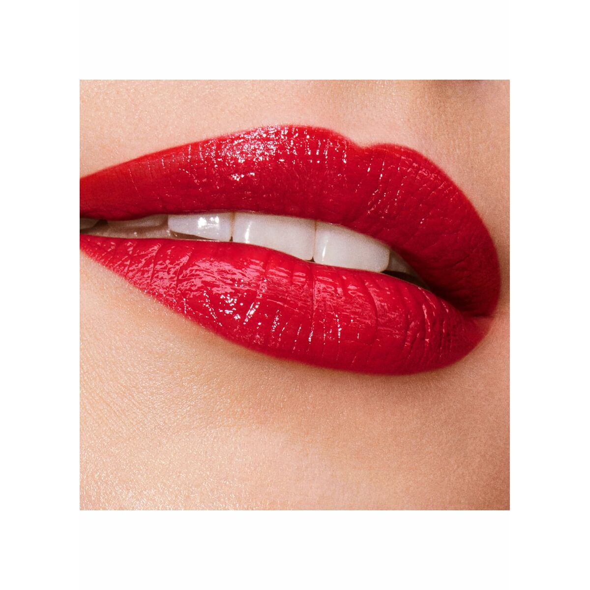 Close-up of full lips wearing Estee Lauder PURE COLOR lipstick Bloody Mary-03, vibrant red shade for a bold look.