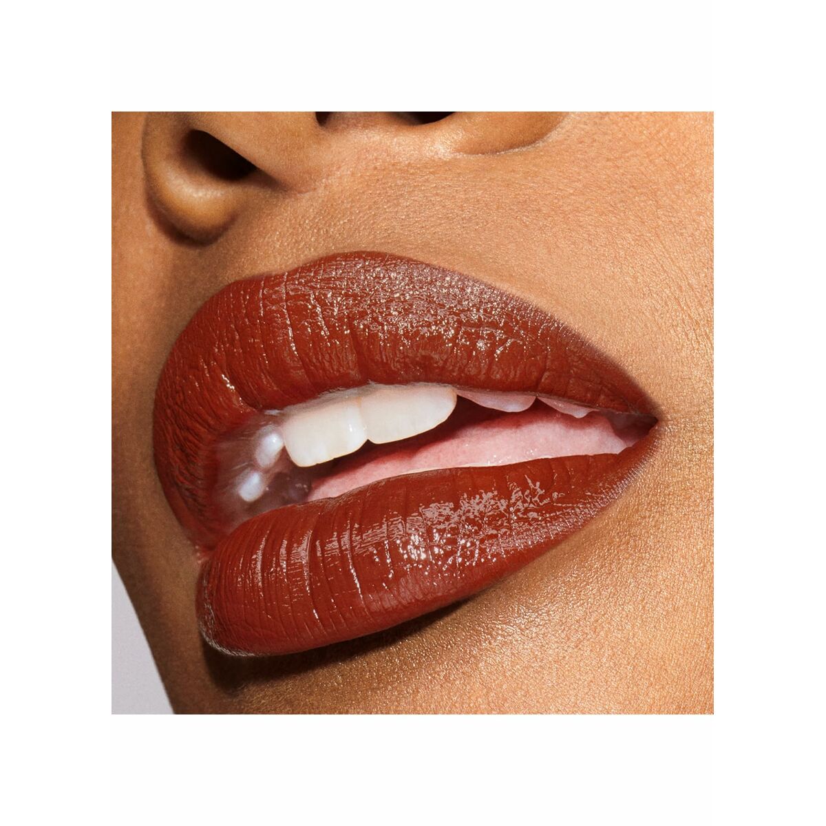 Close-up of lips wearing Estee Lauder PURE COLOR Nº 803-Second Glance Sweet Molasses lipstick.