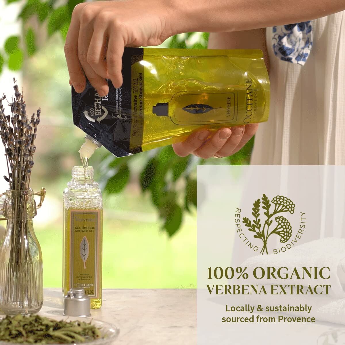 L'Occitane En Provence 100% organic verbena extract being poured into a bottle, emphasizing sustainability and natural ingredients.