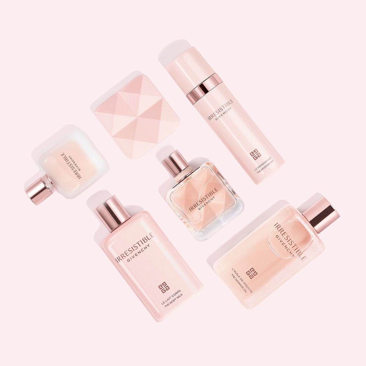 Mousse nettoyante Givenchy Irresistible 200 ml and skincare products arranged on a pink background.