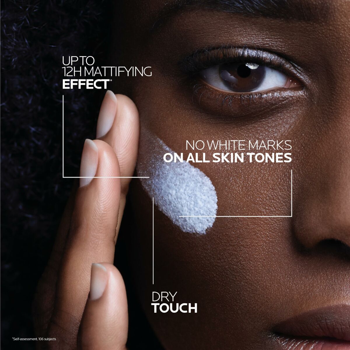 Close-up of hand applying La Roche Posay sunscreen with notes on mattifying effect and no white marks for all skin tones.
