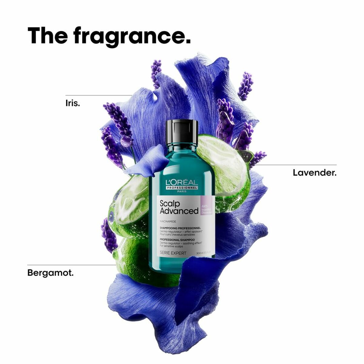 L'Oreal Scalp Advanced shampoo bottle surrounded by lavender, iris, and bergamot flowers.