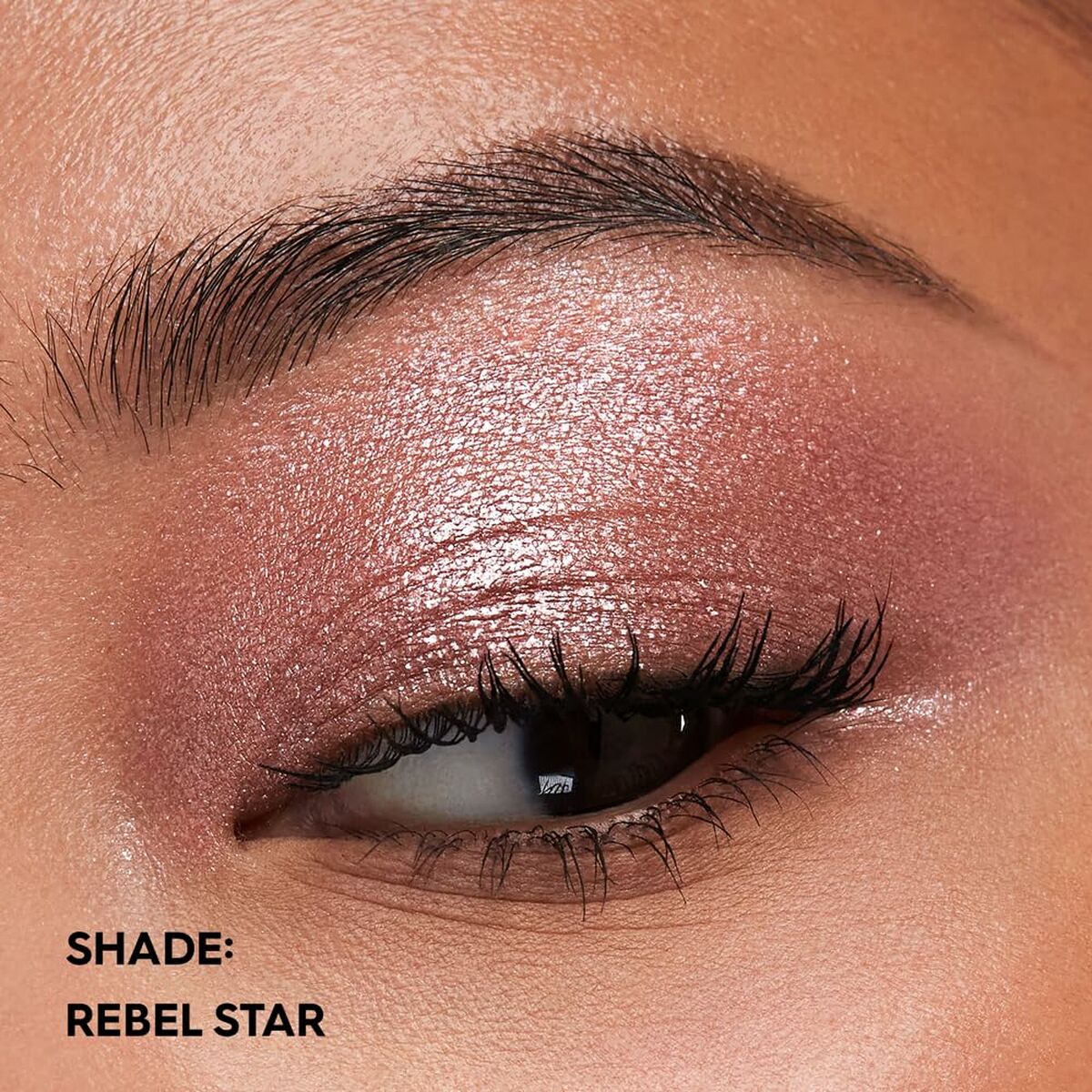 Close-up of an eye showcasing the Rebel Star shade from Urban Decay's 24/7 makeup set.