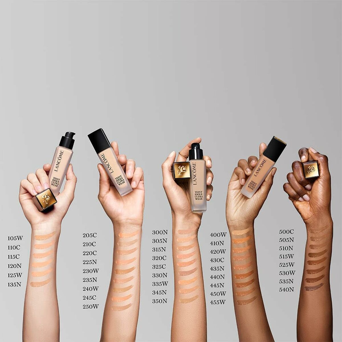 Lancôme Teint Idole Ultra Wear foundation shades displayed on hands, showcasing diverse skin tones and color options.