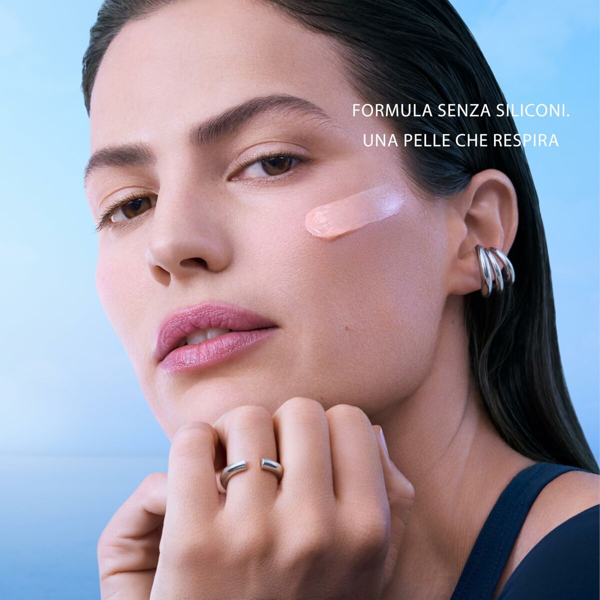 Model showcasing Biotherm skincare formula on her face, promoting skin that breathes without silicone.