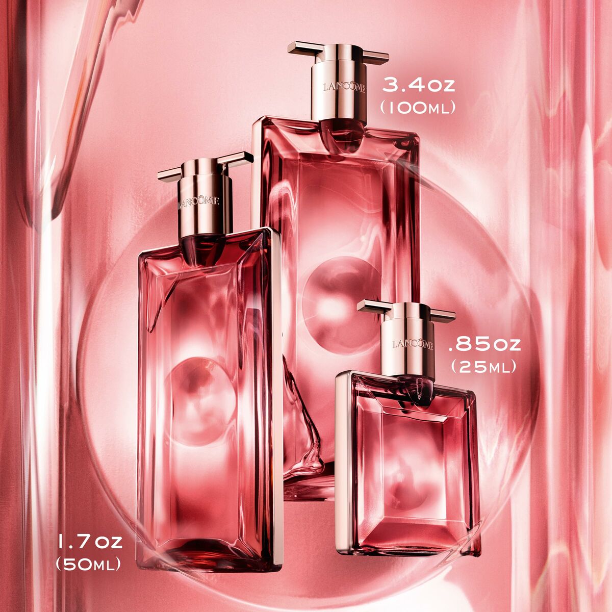 Bottles of Lancôme IDÔLE EDP in various sizes: 50 ml, 100 ml, and 25 ml, against a soft pink background.