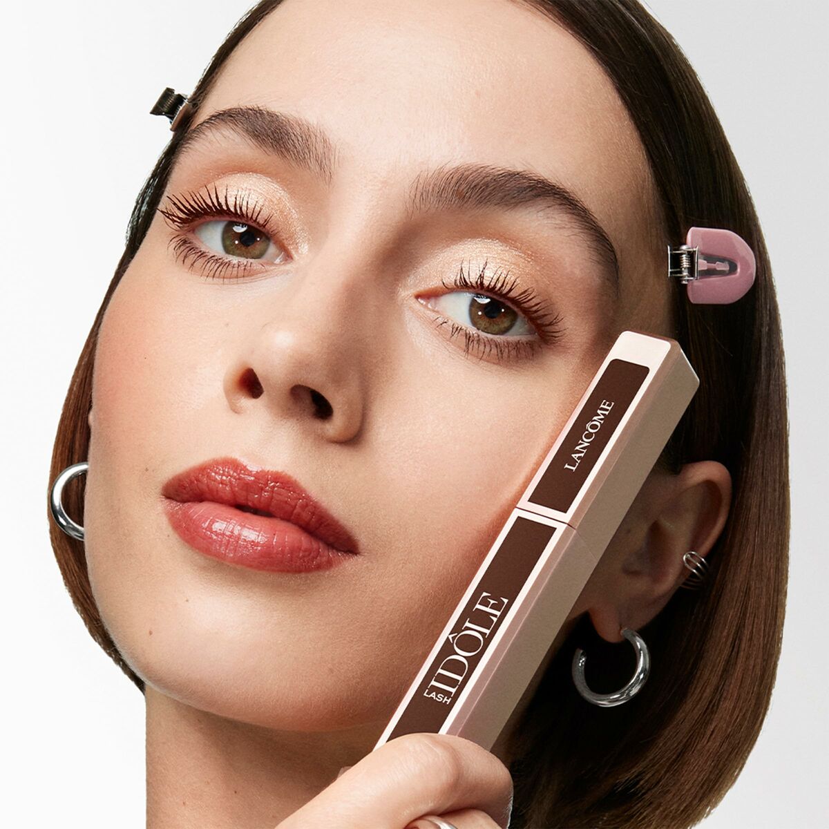 Close-up of a model showcasing Lancôme LASH IDÔLE mascara in brown, highlighting her beautiful, defined eyelashes.