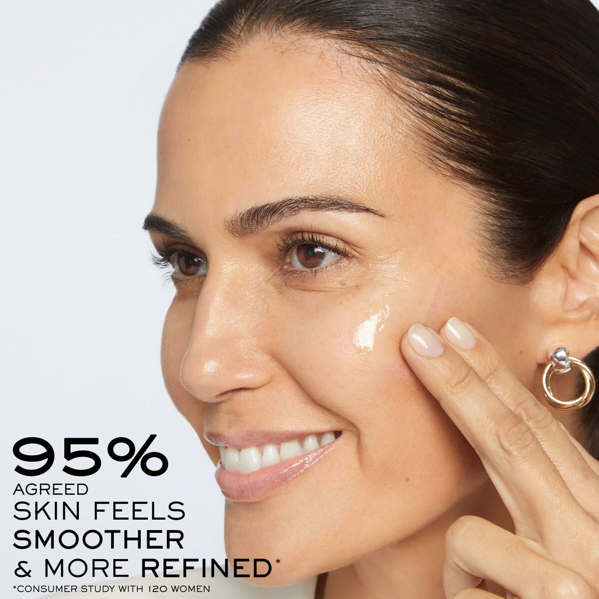 Woman applying Lancôme RÉNERGIE cream on her face, showcasing smoother skin and refined texture, consumer study results displayed.