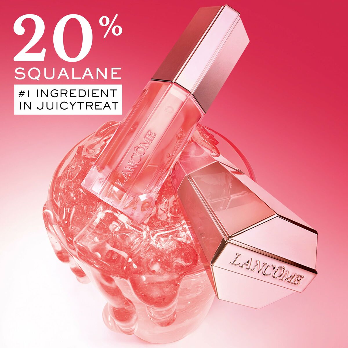 Lancôme JuicyTreat lip product featuring 20% squalane for hydration, showcasing vibrant packaging against a pink background.
