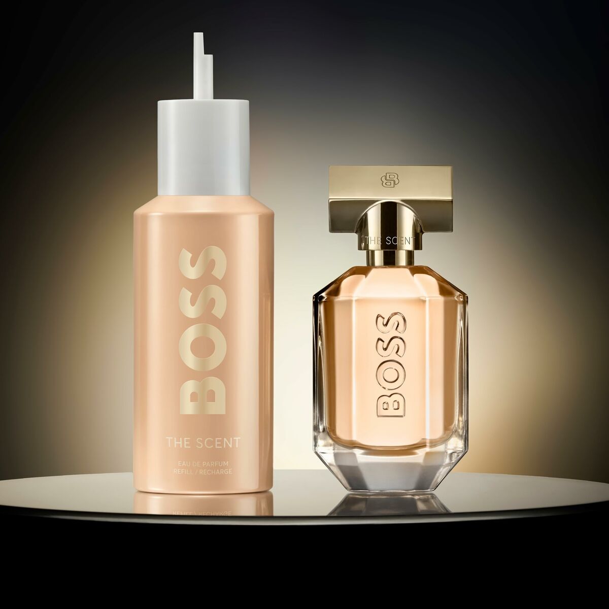 Hugo Boss The Scent for Her 150ml perfume bottles displayed elegantly on a reflective surface.