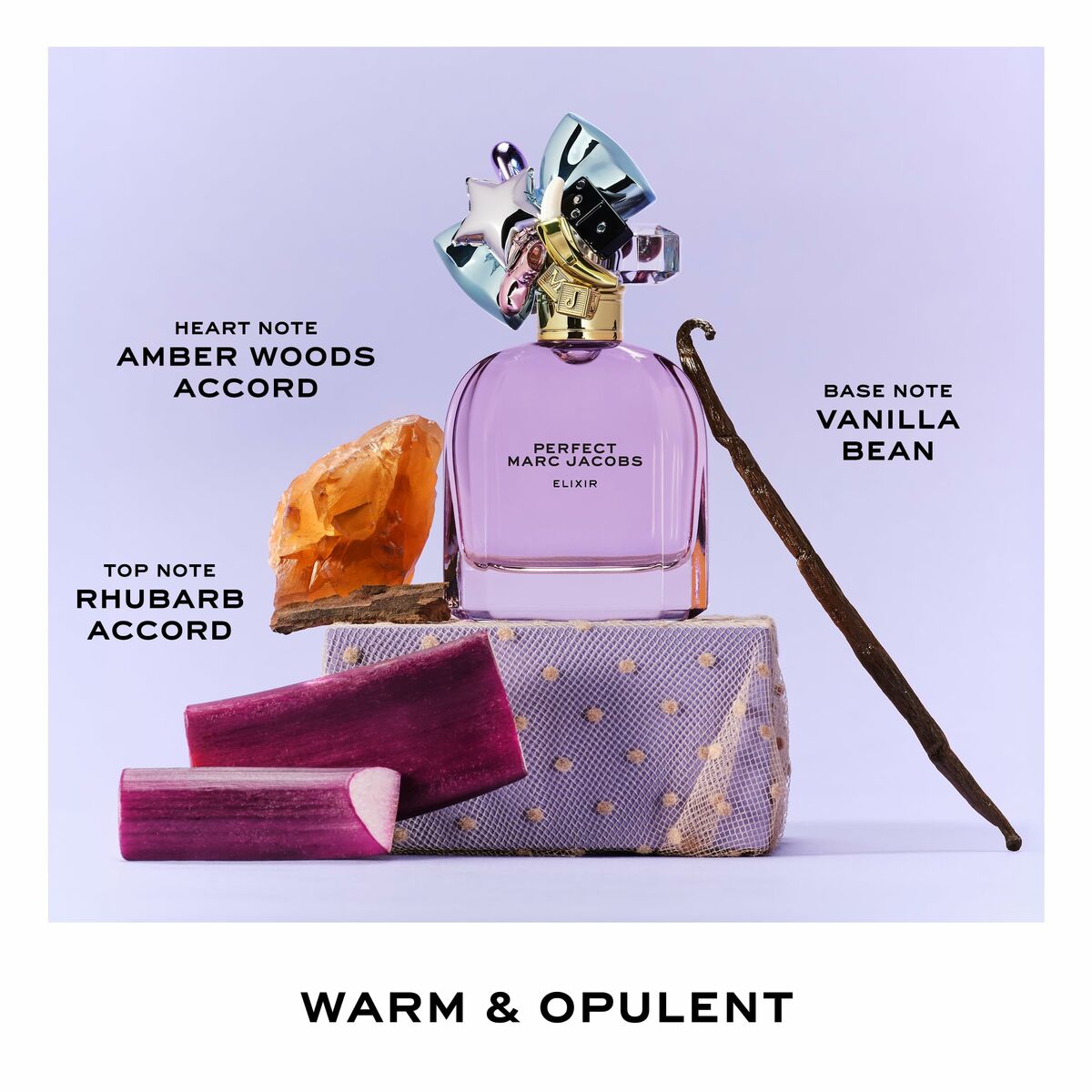 Parfum Unisexe Marc Jacobs Perfect Elixir 50 ml with amber woods, rhubarb, and vanilla bean notes on a stylish backdrop.