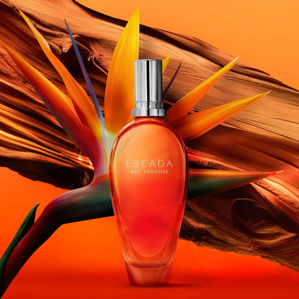 Escada Bali Paradise 30 ml perfume bottle with vibrant orange background and tropical bird of paradise flower.