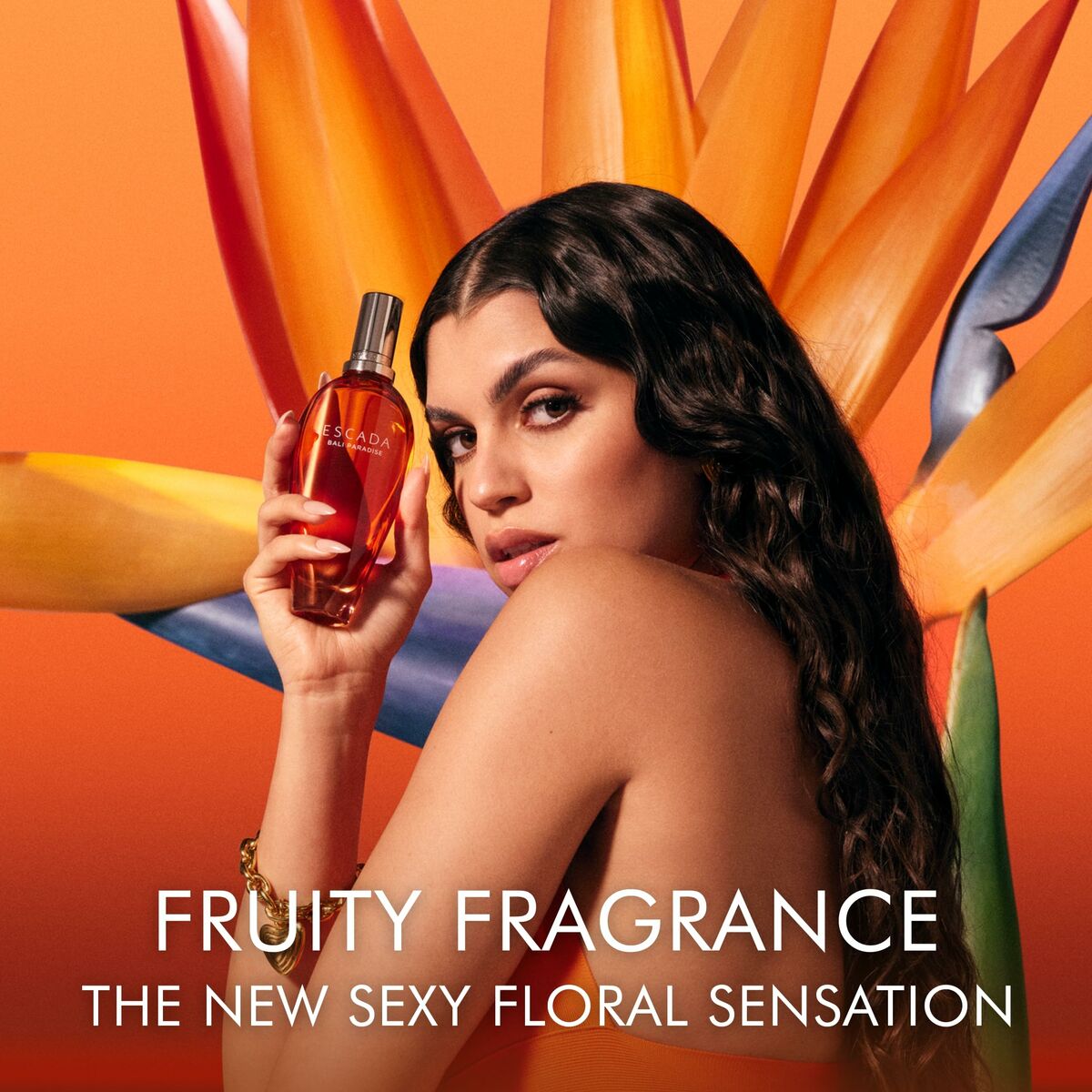 Escada Bali Paradise perfume 30ml with model holding it, floral background, vibrant colors, fruity floral scent.