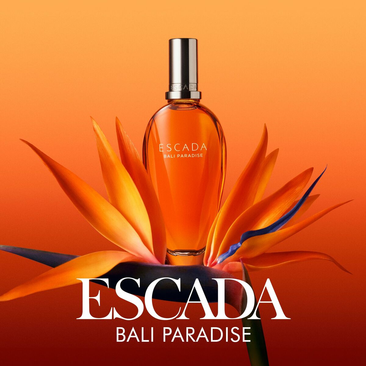Parfum femme Escada Bali Paradise 100 ml, présenté avec une fleur exotique sur fond orange.