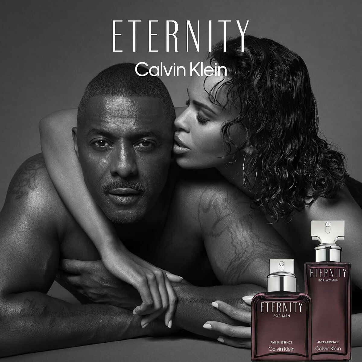 Calvin Klein ETERNITY FOR MEN fragrance displayed with model couple, showcasing elegance and masculinity in a stylish black and white image.