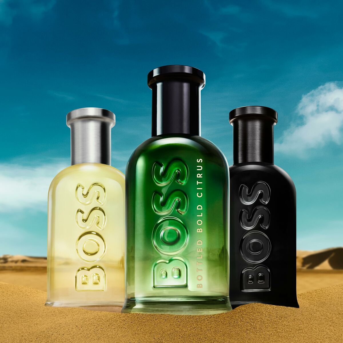 Parfum BOSS BOTTLED collection with three distinct bottles in a desert backdrop.