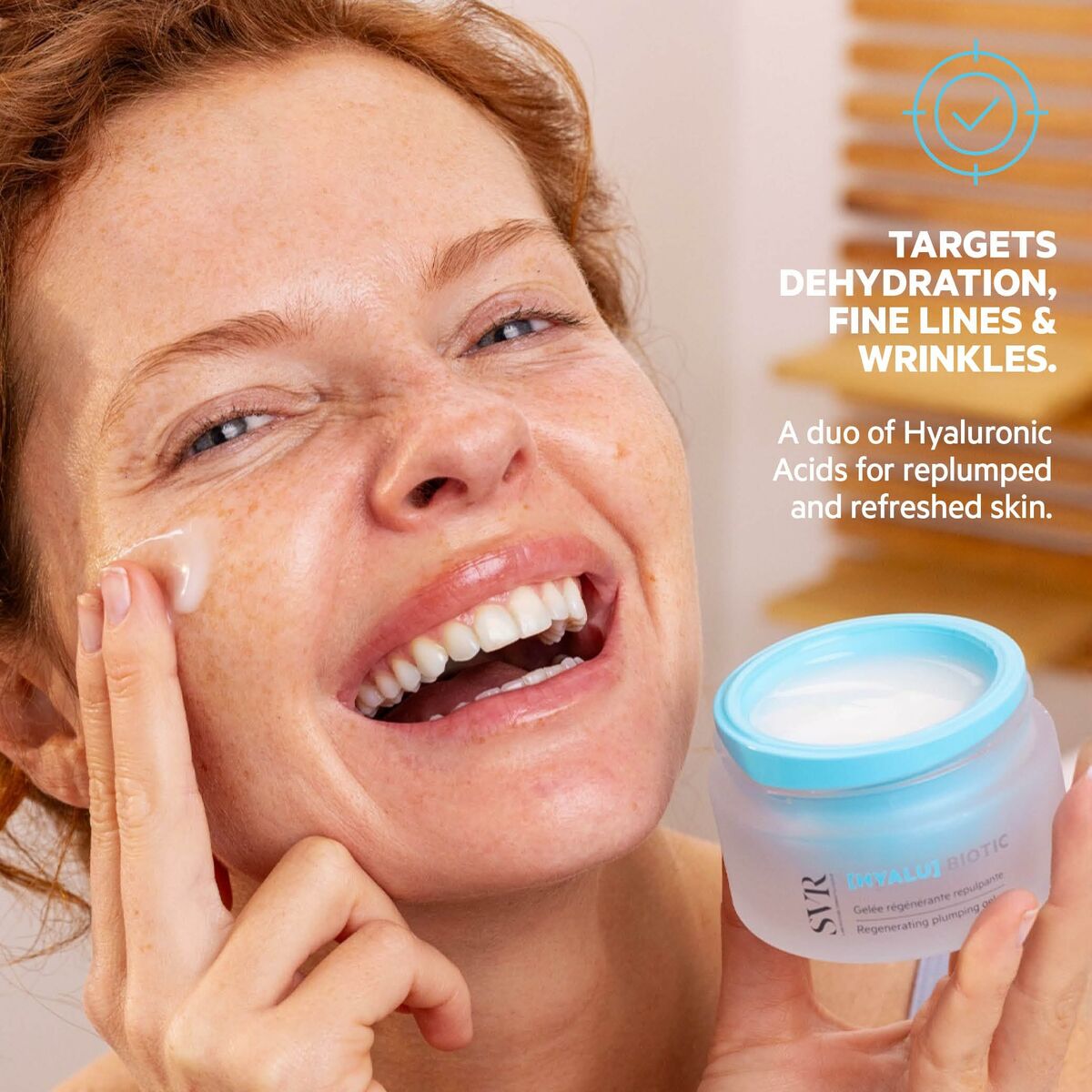 Woman applying SVR BIOTIC face cream, targeting dehydration, fine lines, and wrinkles for refreshed skin.
