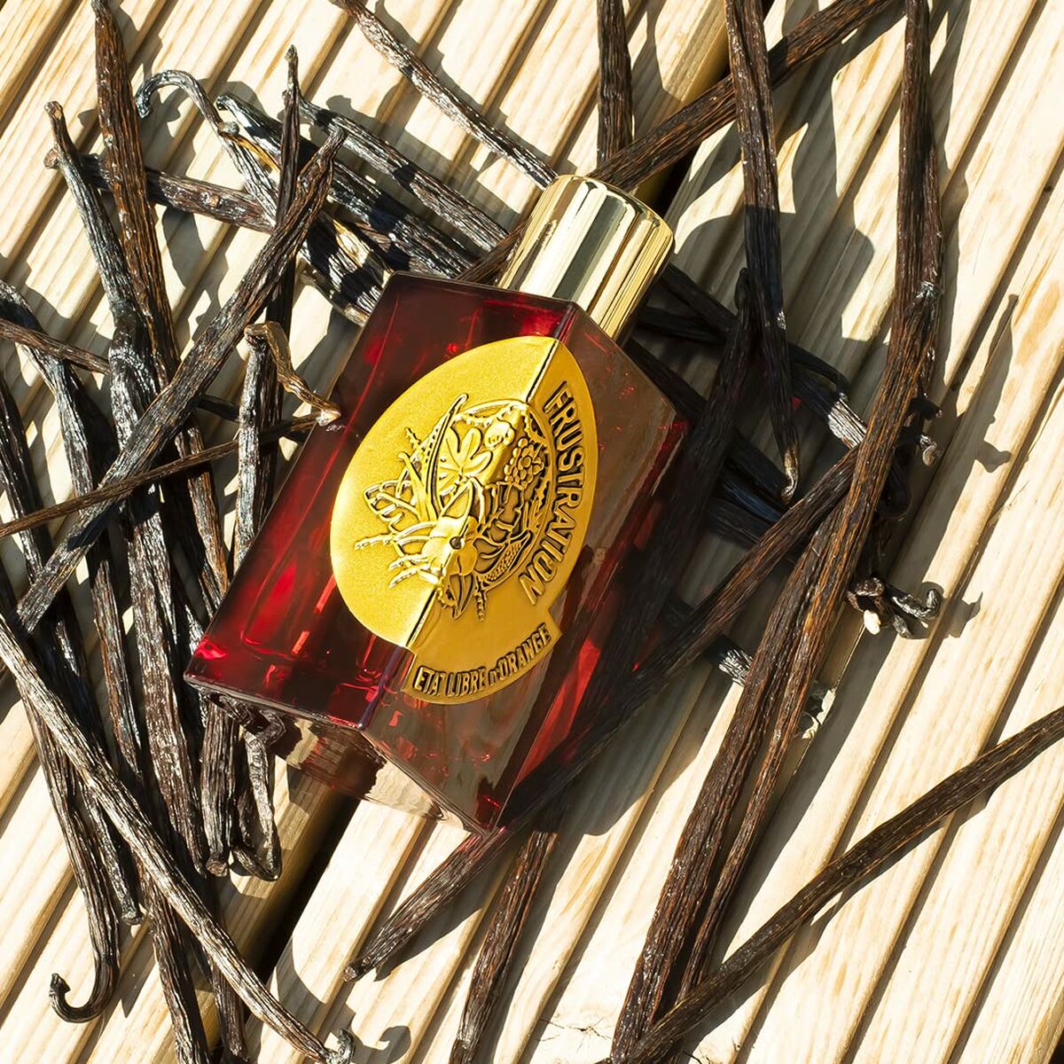 Parfum Femme Etat Libre D'Orange Frustration bottle with vanilla pods, showcasing its unique EDP formula.