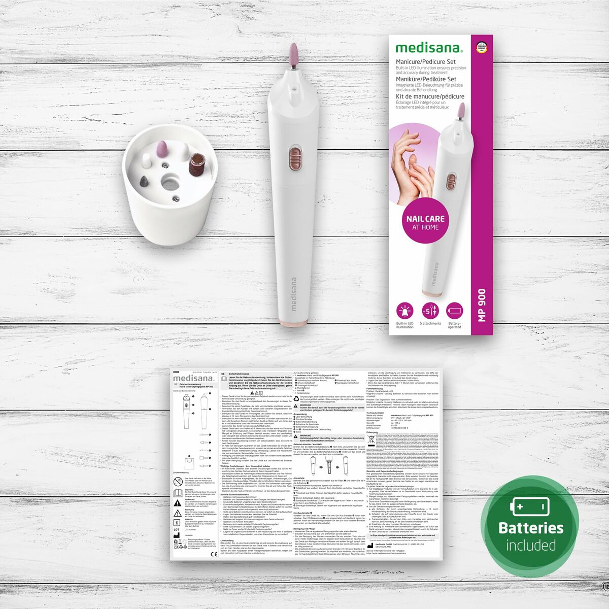 Medisana MP900 manicure and pedicure set displayed with instructions and holder, featuring battery included.