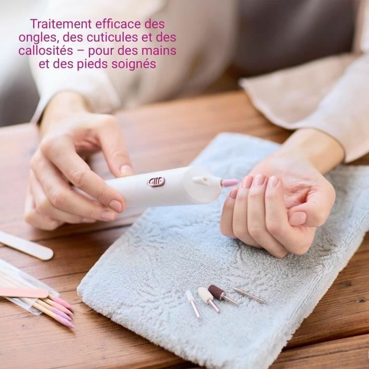 Person using Medisana MP900 manicure tool for effective nail, cuticle, and callus treatment on a soft towel.