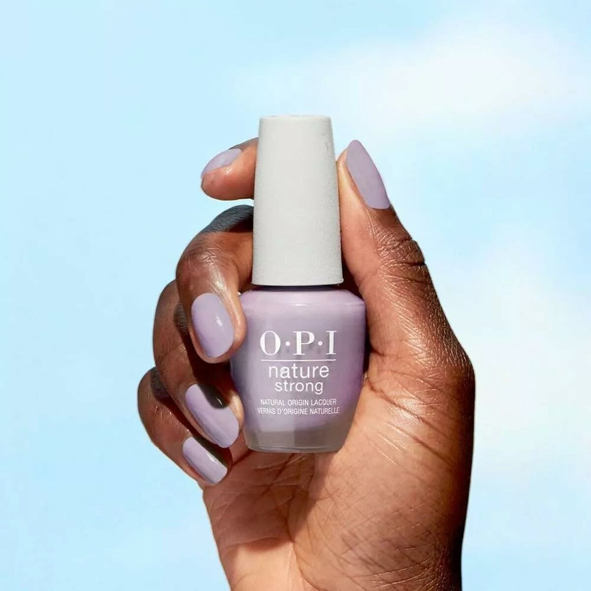 Main image of OPI Nature Strong Dawn Of A New Gray 15 ml nail polish held in hand, showcasing vegan beauty product.