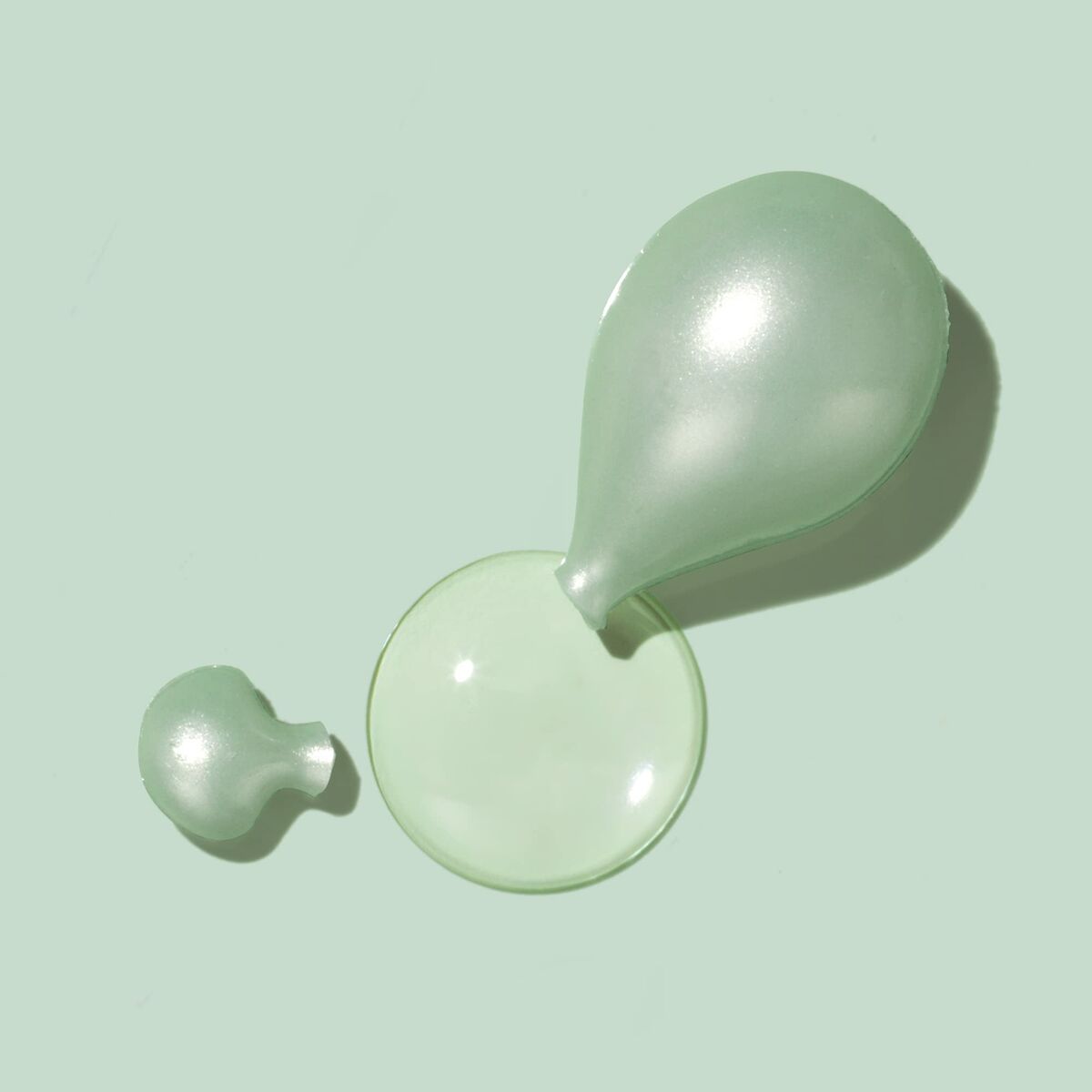 Eve Lom facial oil capsules in two sizes, showcasing their hydrating and cleansing properties.