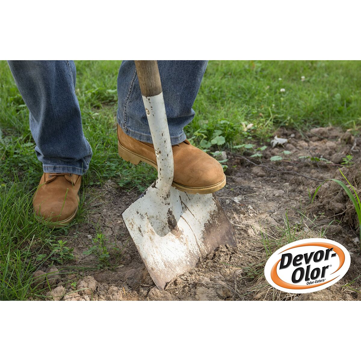Person using a shovel to dig in the garden, featuring Devor-Olor branding.