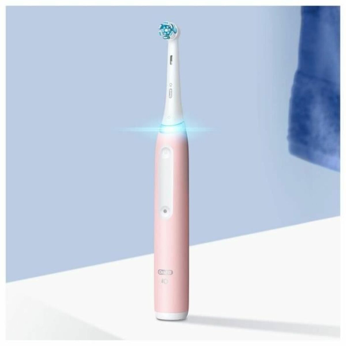 Brosse à dents électrique Oral-B io Series 3 en rose avec LED, conçue pour améliorer l'hygiène buccale.