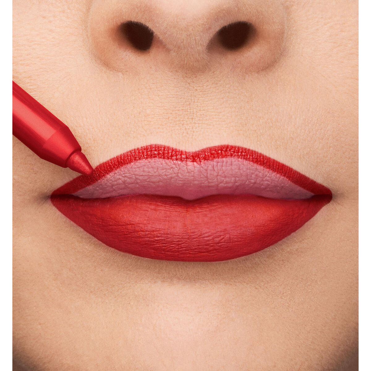 Close-up of lips being applied with Collistar Nº 7-Rosso Ciliegia lipstick for a bold, vibrant look.