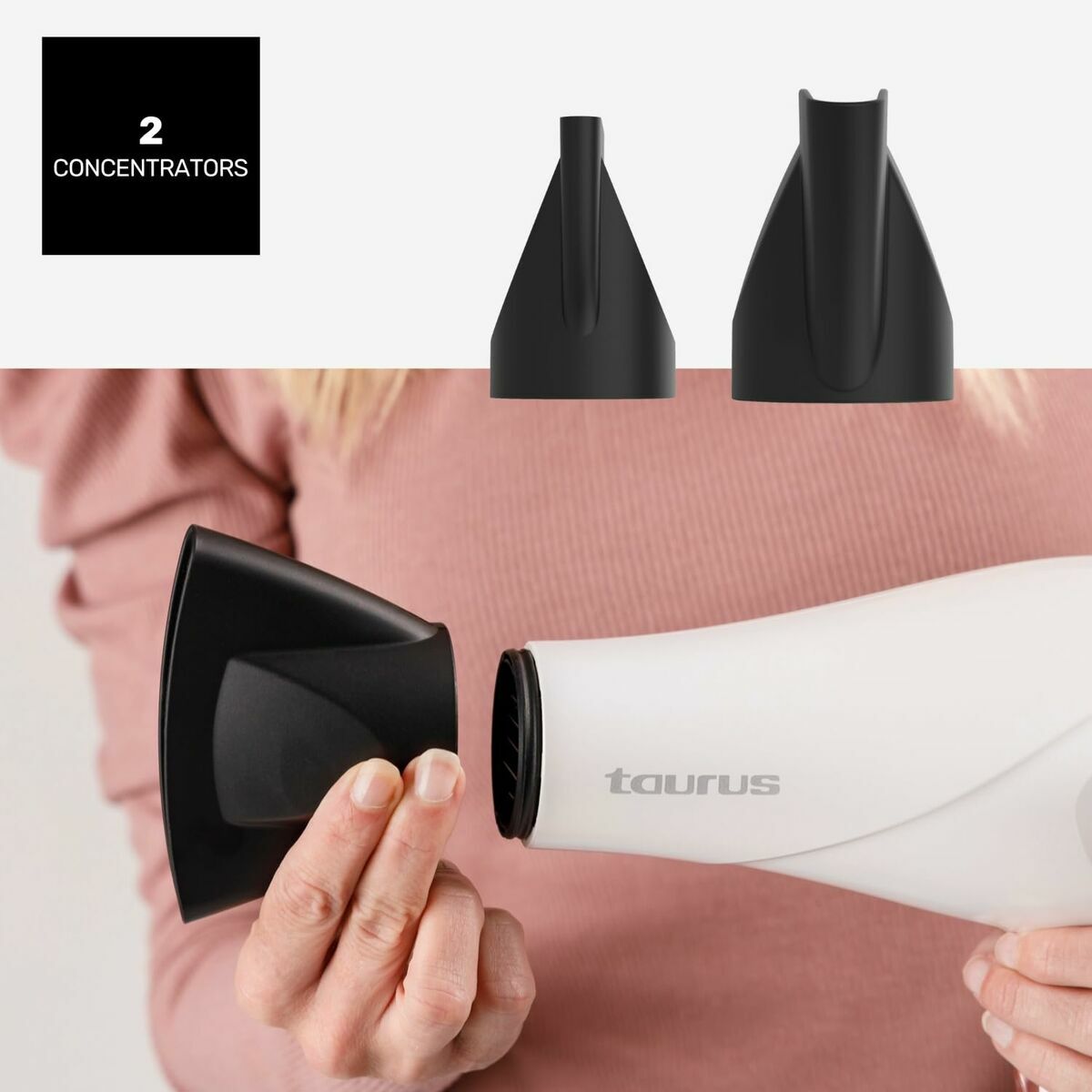 Sèche-cheveux Taurus FASHION 2600 IO avec deux embouts concentrateurs en main, design élégant et fonctionnel.