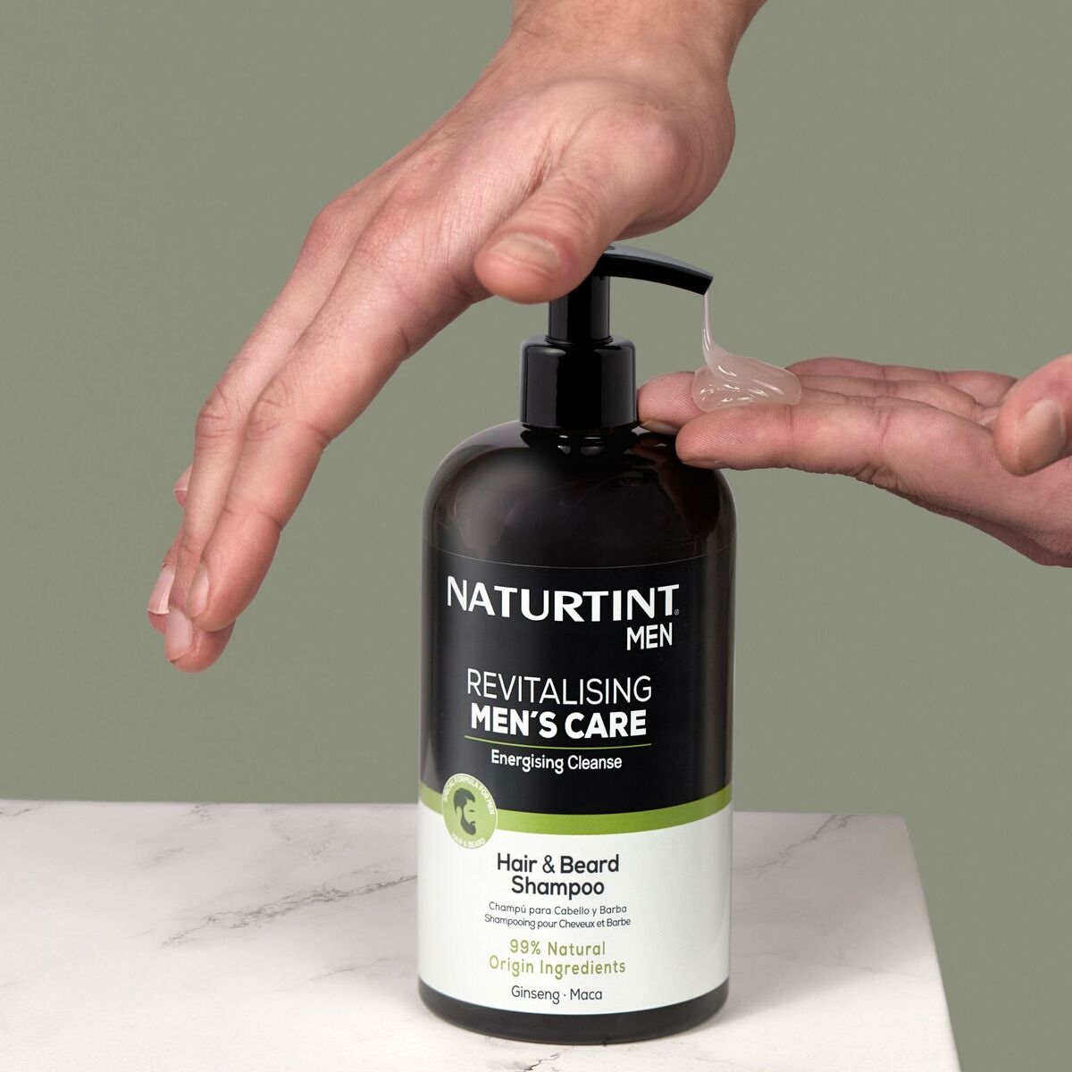 Naturtint Men's Revitalising Shampoo being dispensed from a pump for hair and beard care.