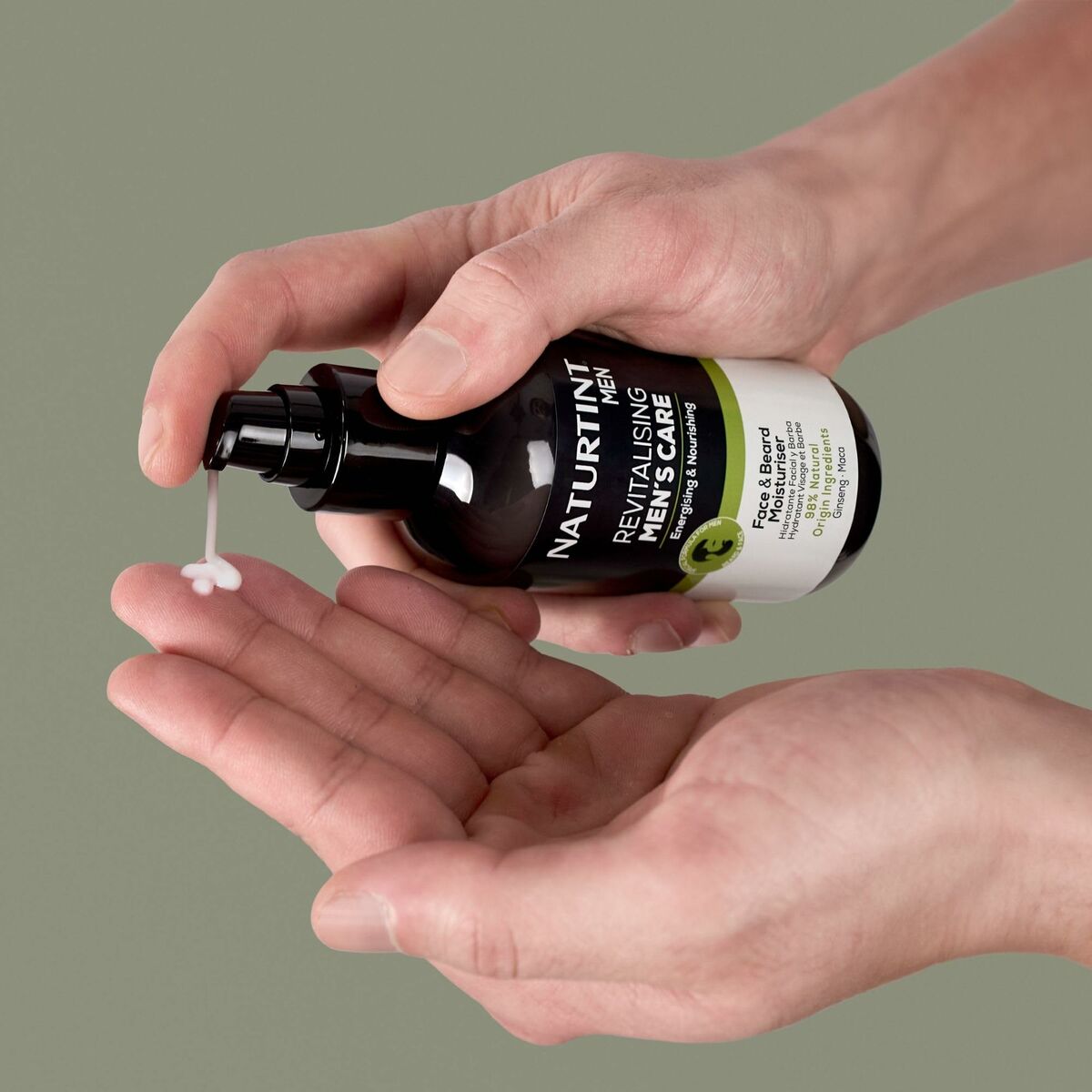 Naturtint MEN shaving set product in hands, dispensing revitalizing cream, promoting men's skincare.