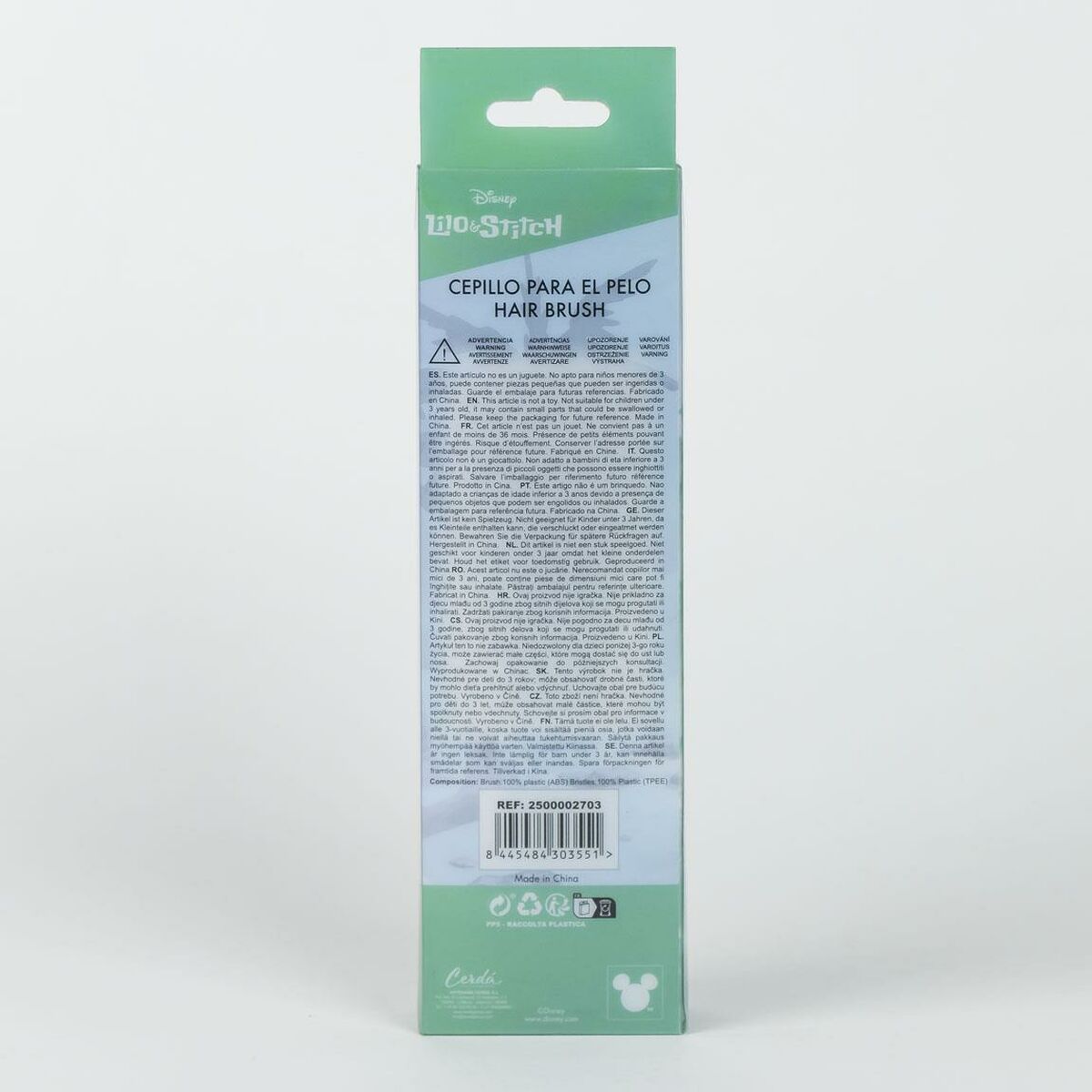 Brosse Stitch pour enfants, dos de l'emballage avec consignes de sécurité et informations sur le produit de coiffure.