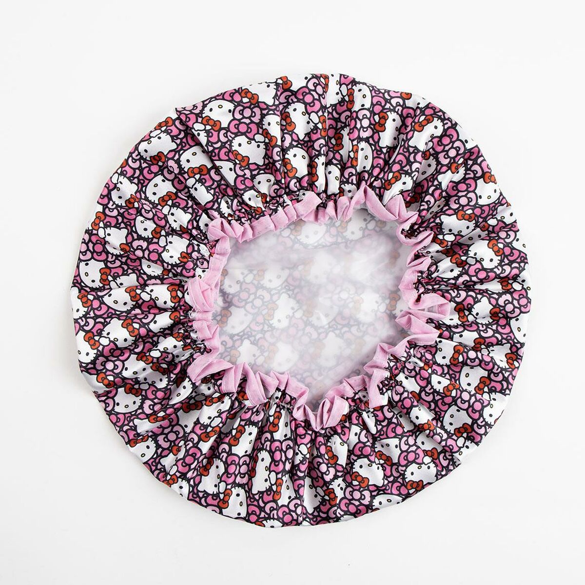 Bonnet de douche Hello Kitty rose en polyester avec motif coloré, idéal pour l'hygiène intime.