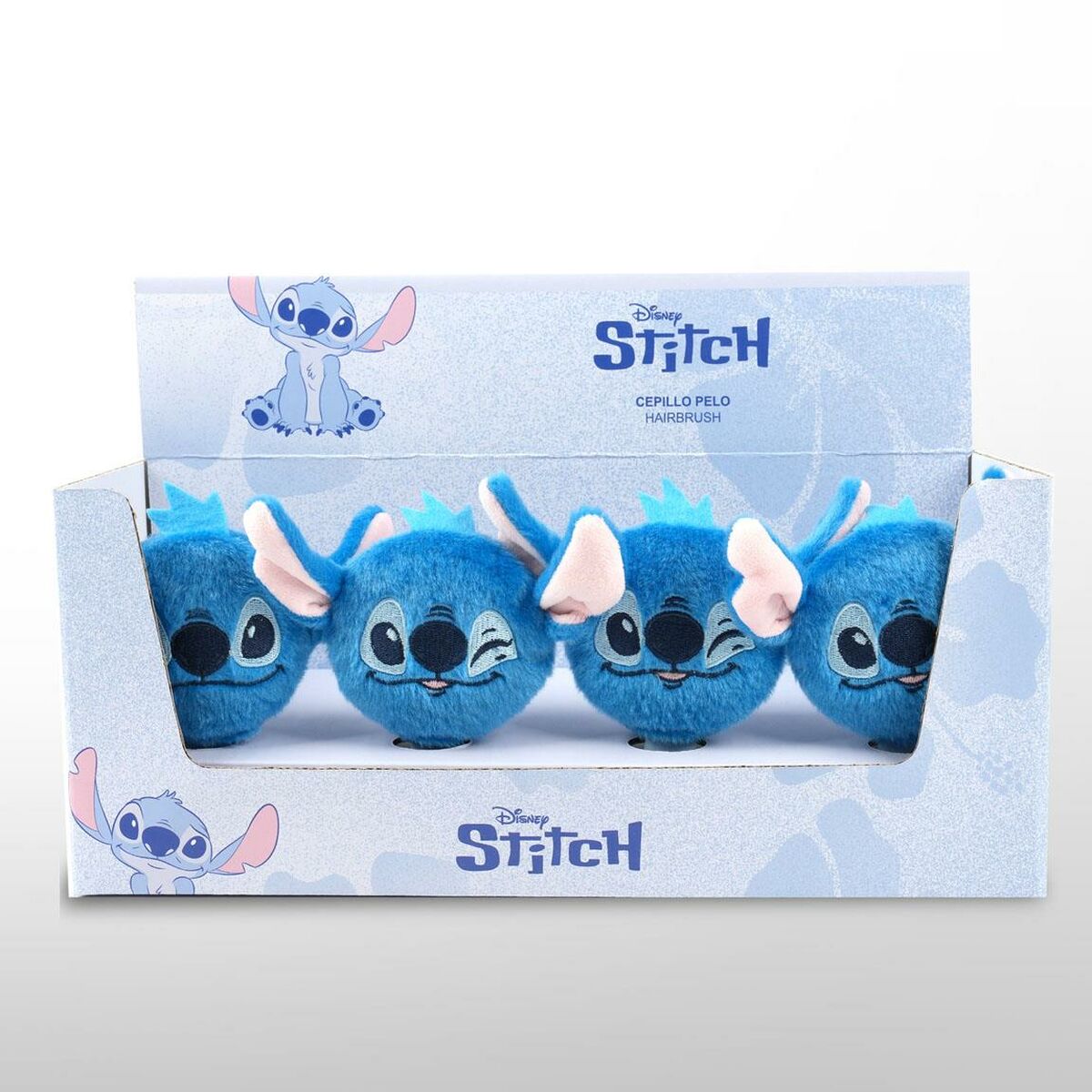 Set of blue Stitch-themed hairbrushes displayed in a box, featuring cute designs inspired by the character.