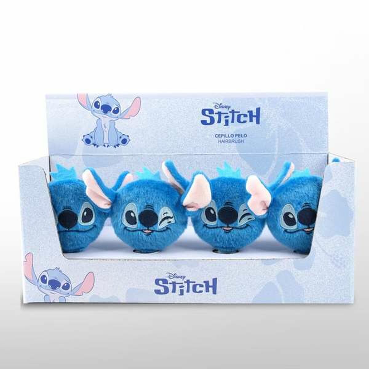 Ensemble de quatre brosses démêlantes Stitch en bleu, présentées dans un emballage attrayant avec motif Disney.