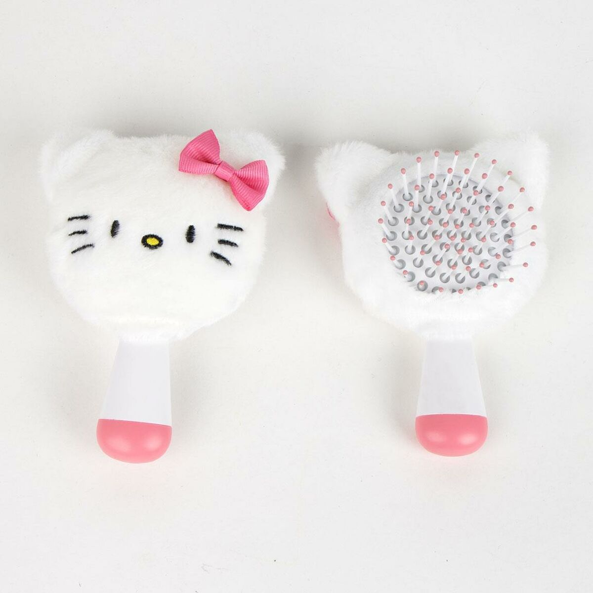 Brosse Démêlante Hello Kitty Blanc avec nœud rose, idéale pour le coiffage quotidien et le soin des cheveux.