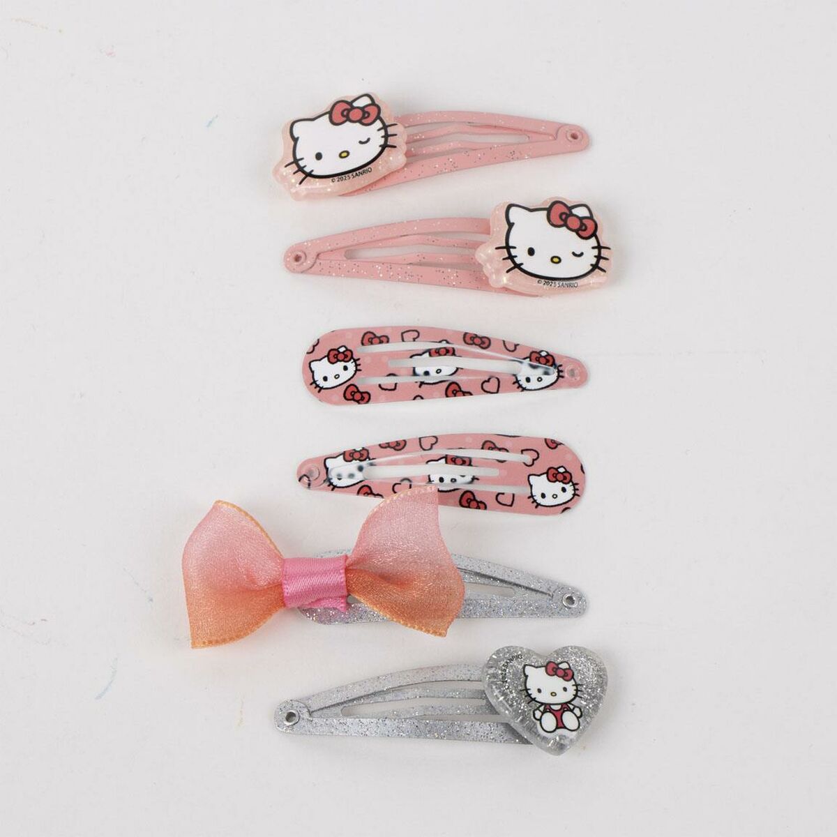 Ensemble de pinces à cheveux Hello Kitty rose pour enfants, incluant divers designs et un nœud en satin.