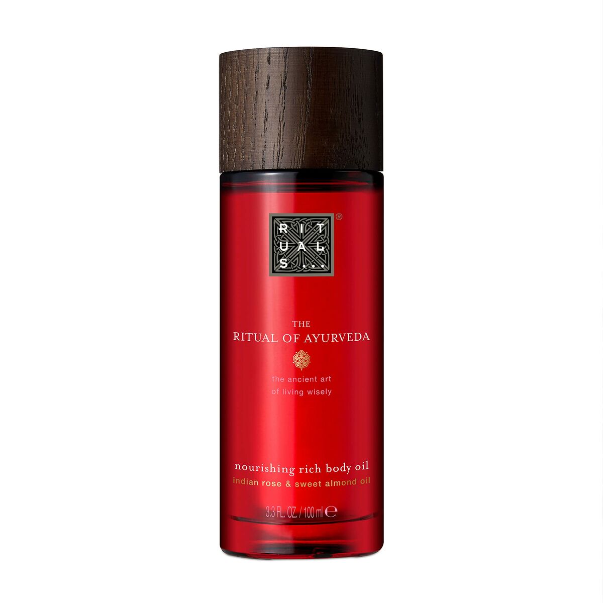 Rituals The Ritual Of Ayurveda nourishing rich body oil in a sleek red bottle with wooden cap.