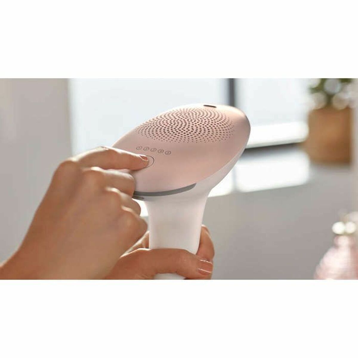 Main view of the Philips BRI921/00 Lumea IPL hair removal device in use, showcasing its ergonomic design and controls.