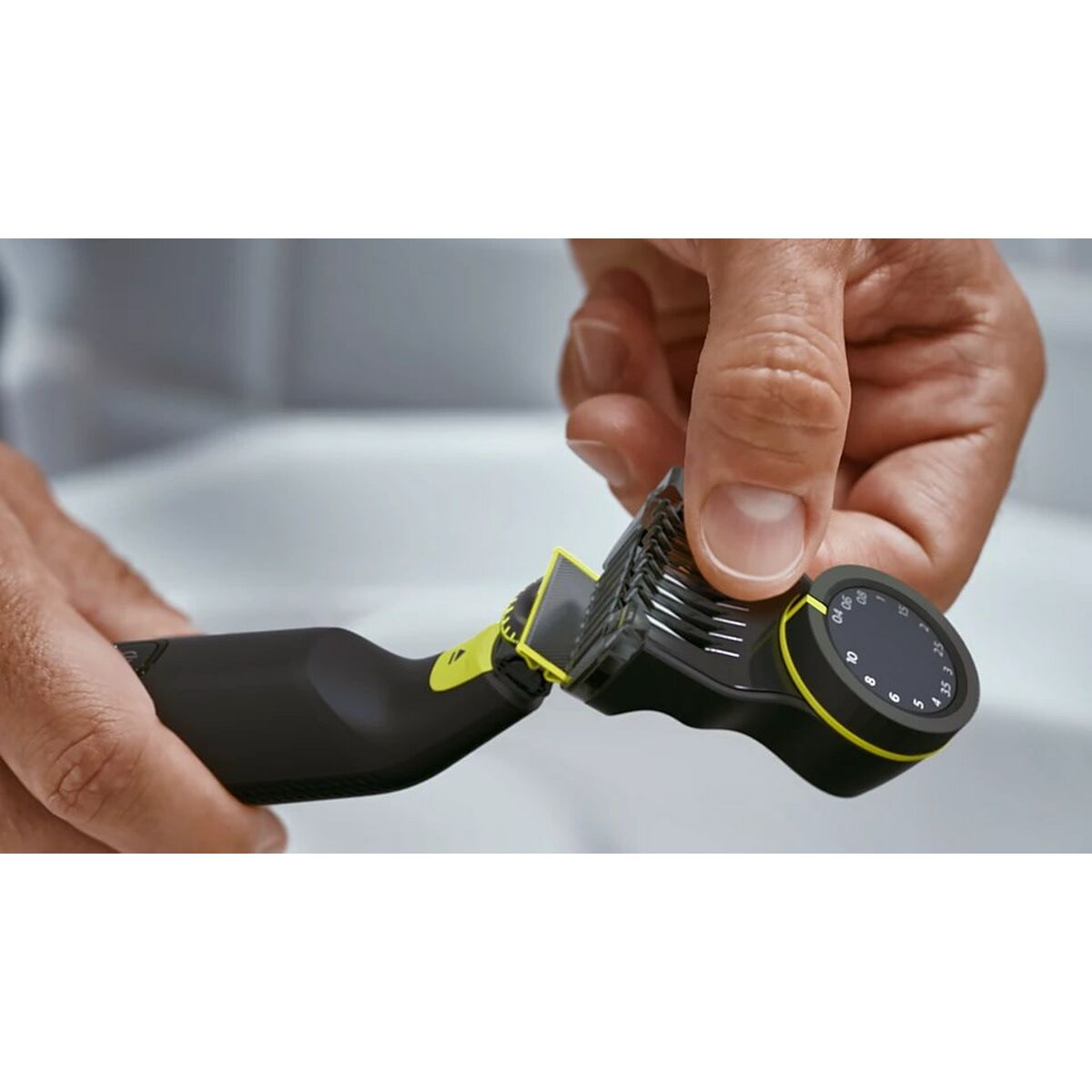 Philips QP6542/15 trimmer being adjusted with a hand, showcasing its unique cutting feature.